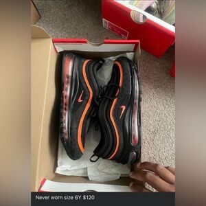 Brand new orange and black Nikes size 6Y (big kids)